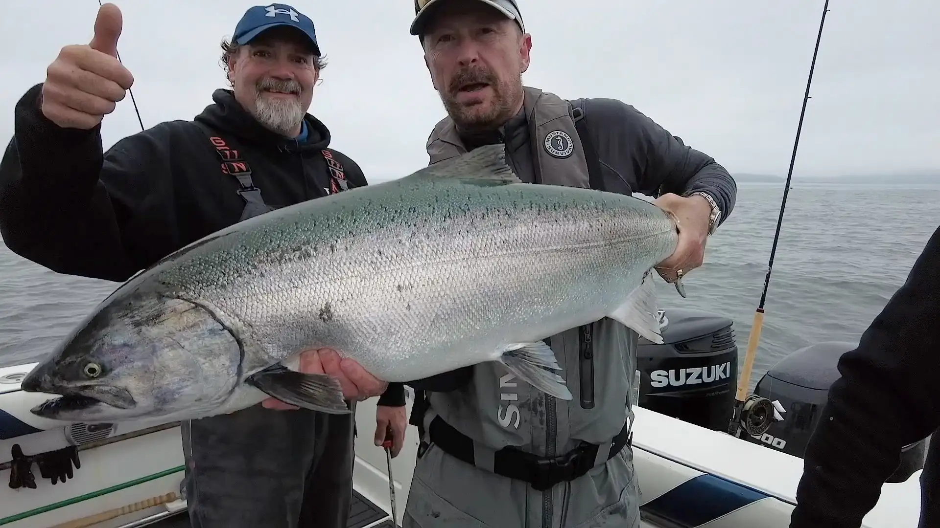 Two Fishermen off the West Coast of BC showing their catch
